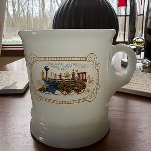 Cream Ceramic Mug with Blue and Gold Train Motif